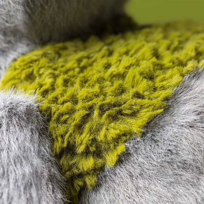 Close up of Jellycat plush toy showing grey and bright green textured faux fur