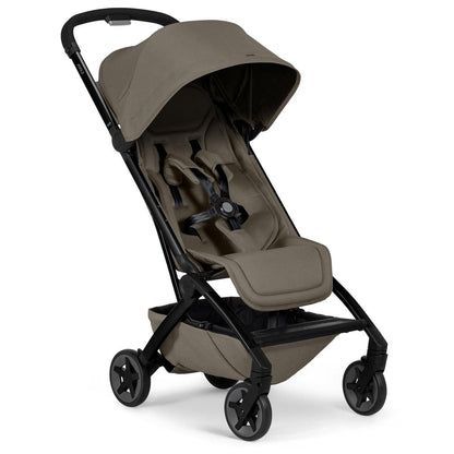 Hazel brown lightweight compact stroller by Joolz with black frame, five-point harness, and adjustable canopy, side view