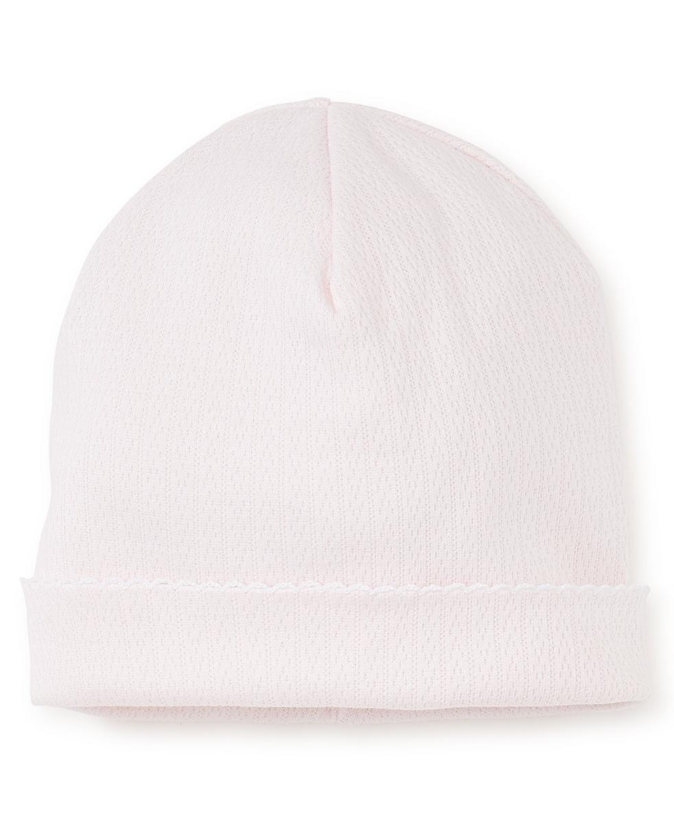 Pale pink Kissy Kissy baby beanie with a folded brim and scalloped edge