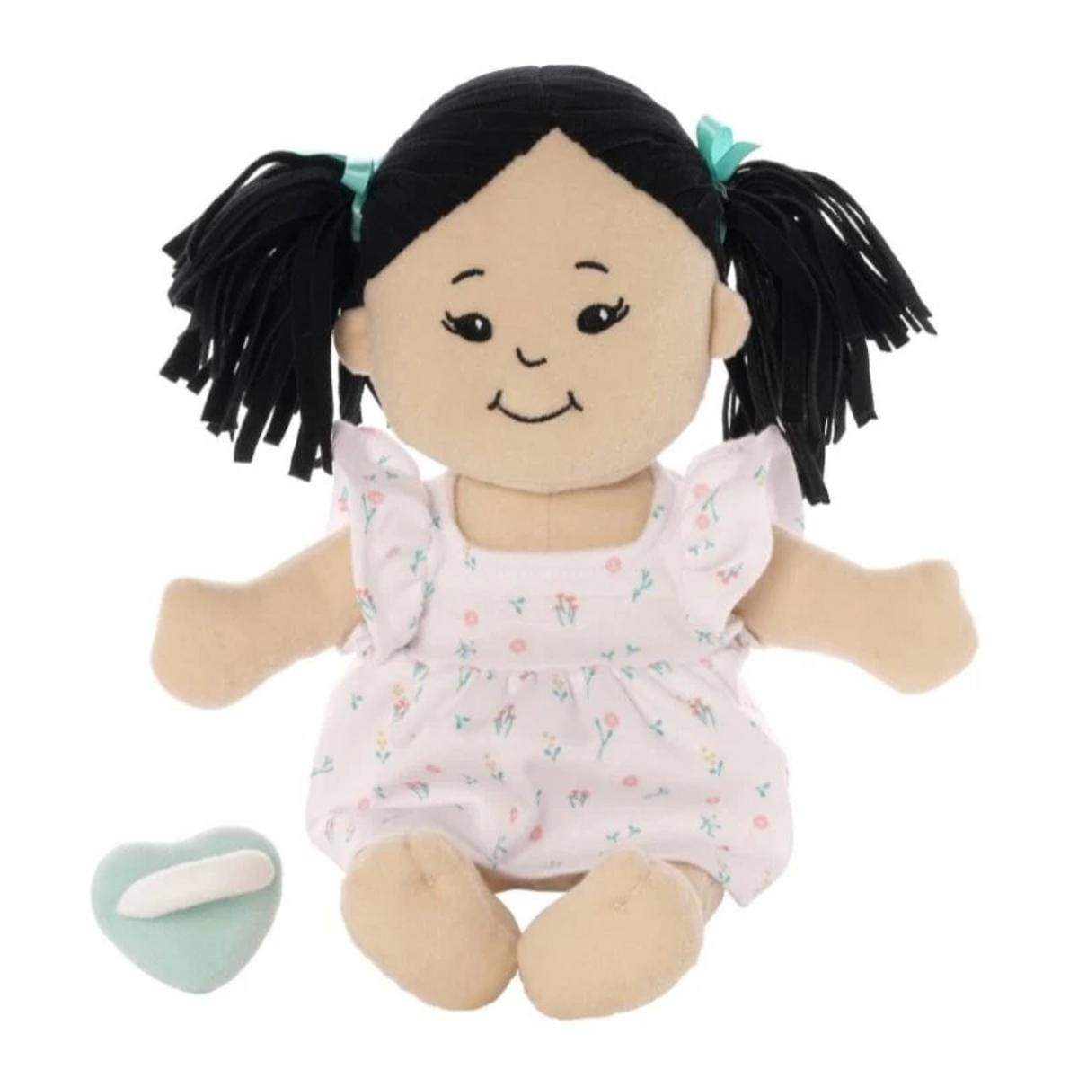 Manhattan Toy soft doll with black hair in pigtails wearing a white floral dress with a small mint green heart accessory