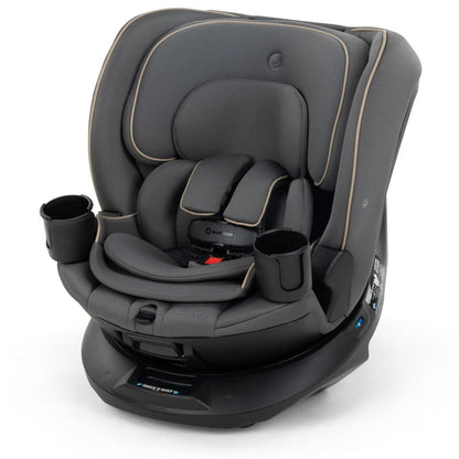Dark gray textured fabric convertible car seat by Maxi-Cosi with beige stitching, side cup holders, and 360-degree rotating base, front view