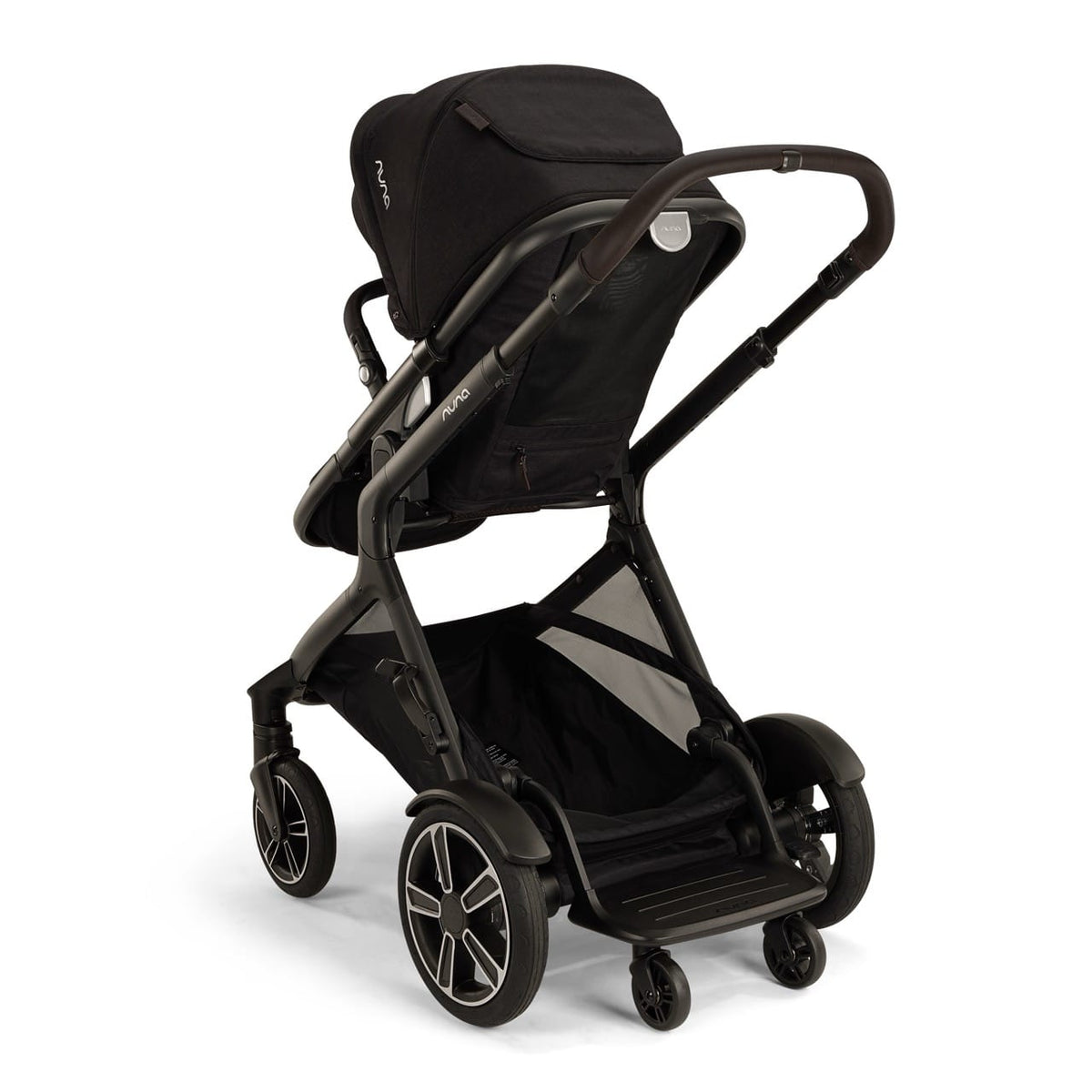 Nuna black stroller viewed from the rear showing the storage basket and wheels