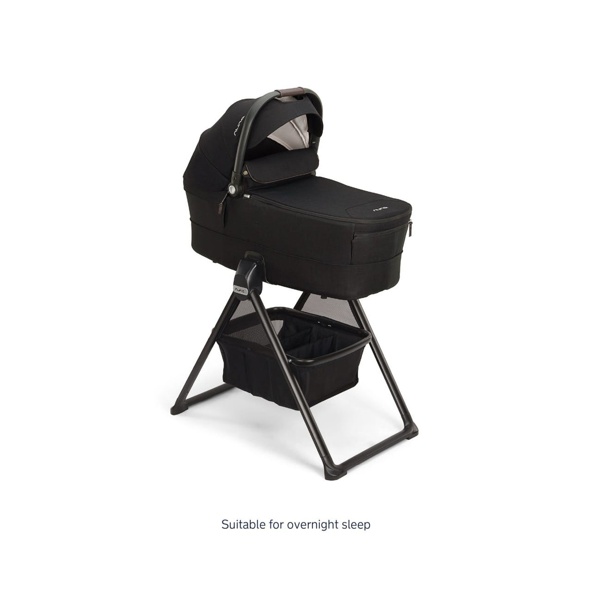 Nuna bassinet on a black folding stand with a storage basket underneath