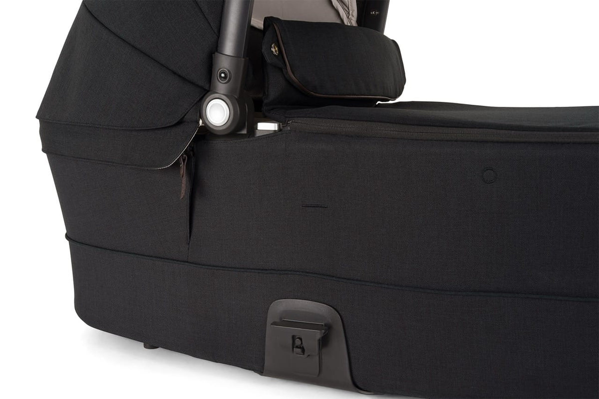 Close up of black fabric carrycot side profile with hinge mechanism