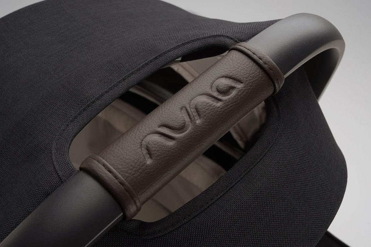 Nuna infant car seat leatherette carry handle with embossed logo