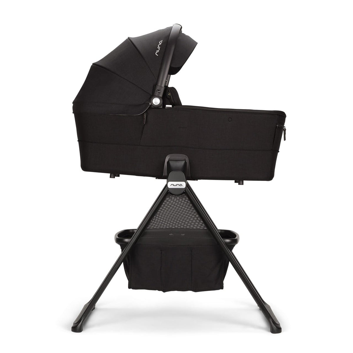 Nuna black bassinet on a folding stand with storage basket
