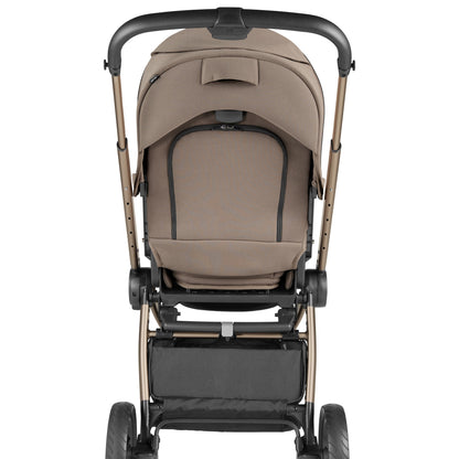 Rear view of a brown Peg Perego stroller with a storage basket and adjustable handlebar