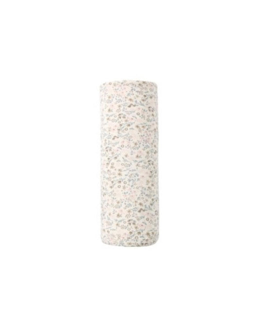 Rolled baby swaddle blanket with a cream background and small floral print
