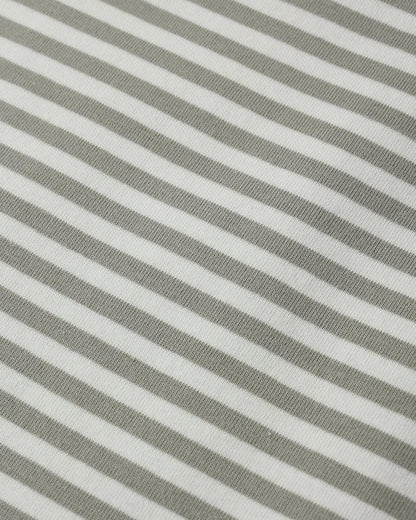 Quincy Mae fabric with a pattern of thin grey and white diagonal stripes