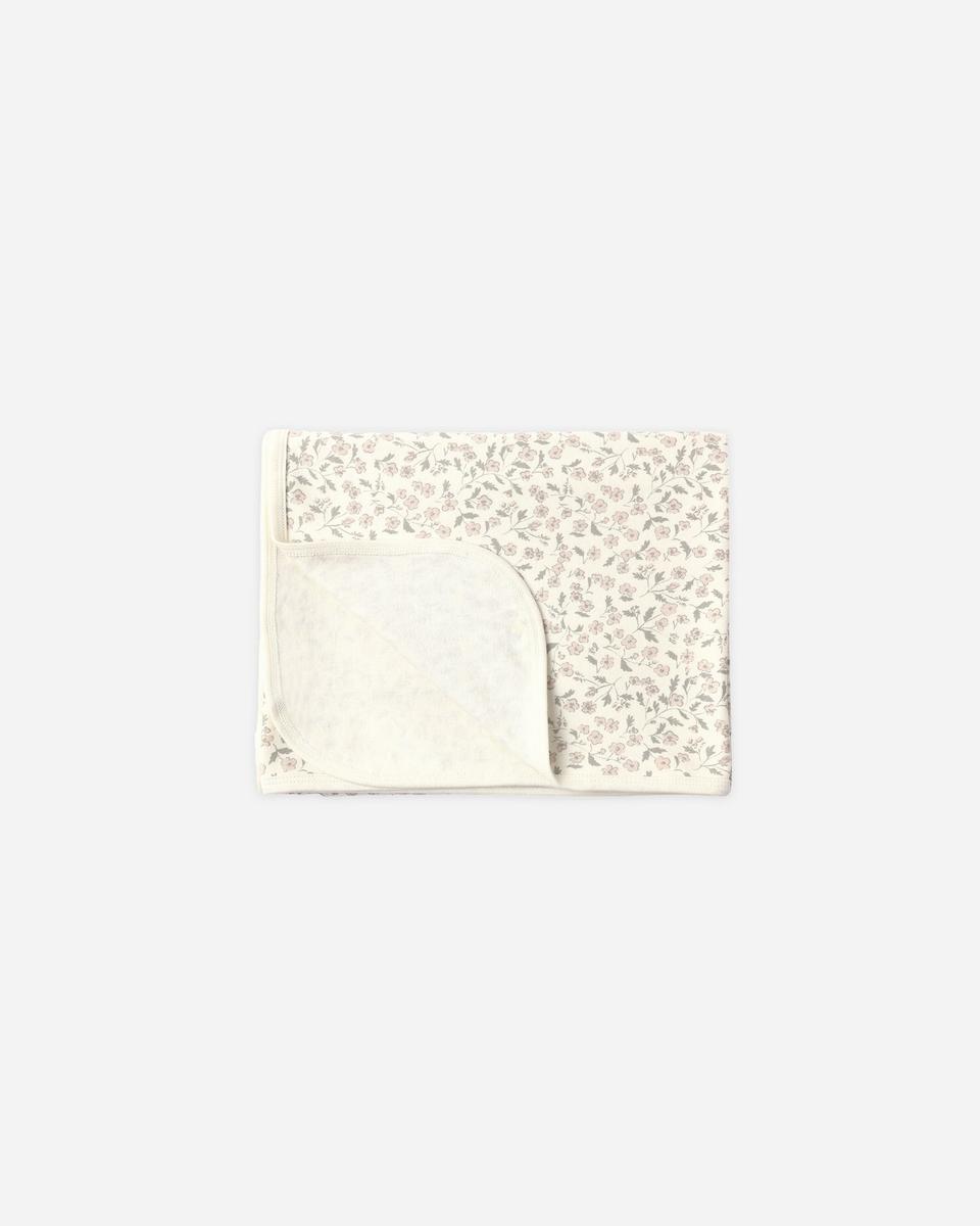 Quincy Mae folded baby blanket with pink floral print on cream background