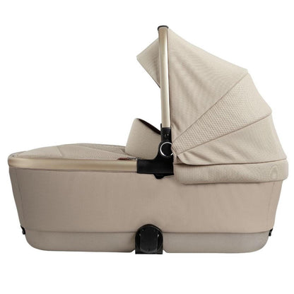 Stone-colored folding bassinet by Silver Cross with textured fabric canopy and side view design
