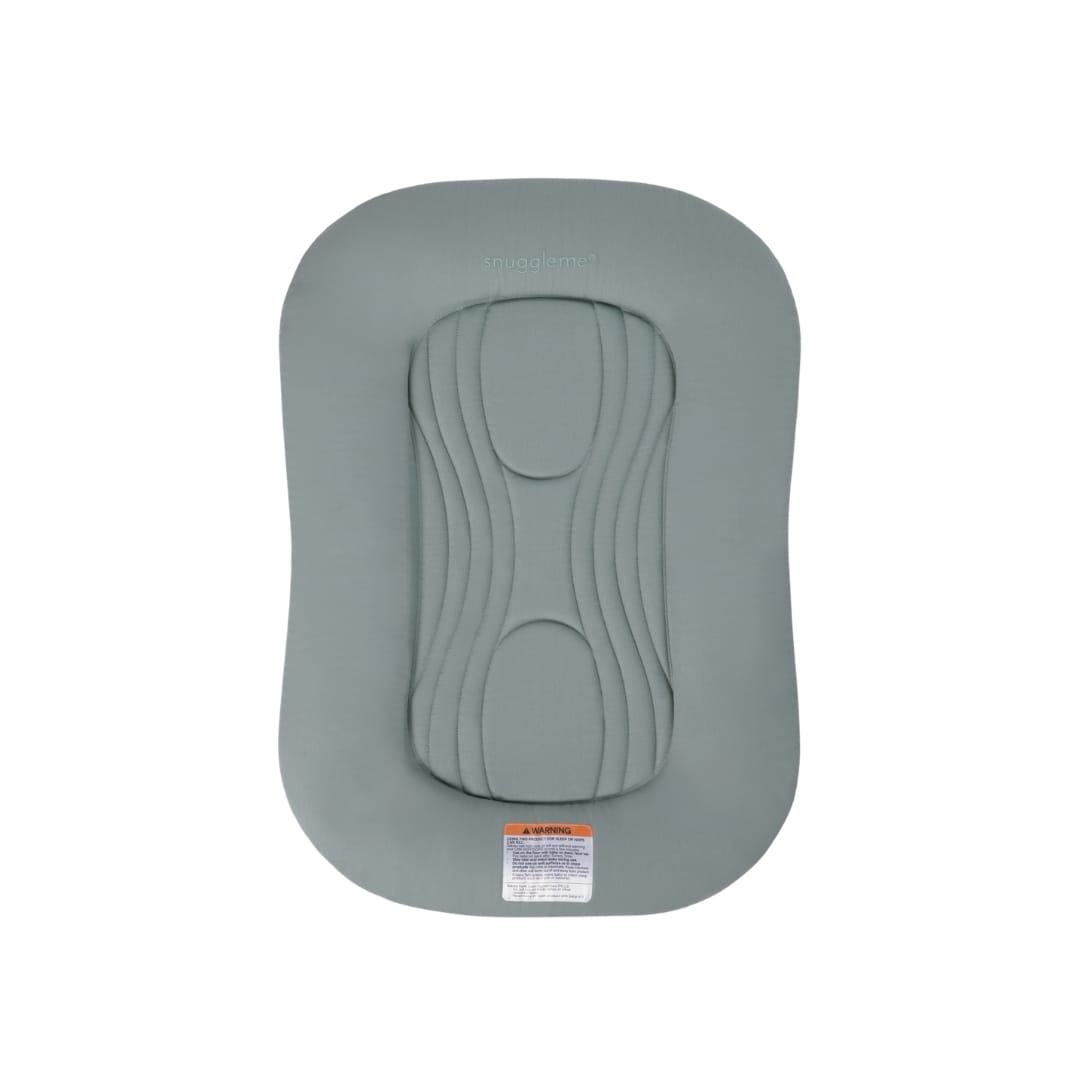 Sage green Snuggle Me infant lounger with central quilted pad and safety warning label