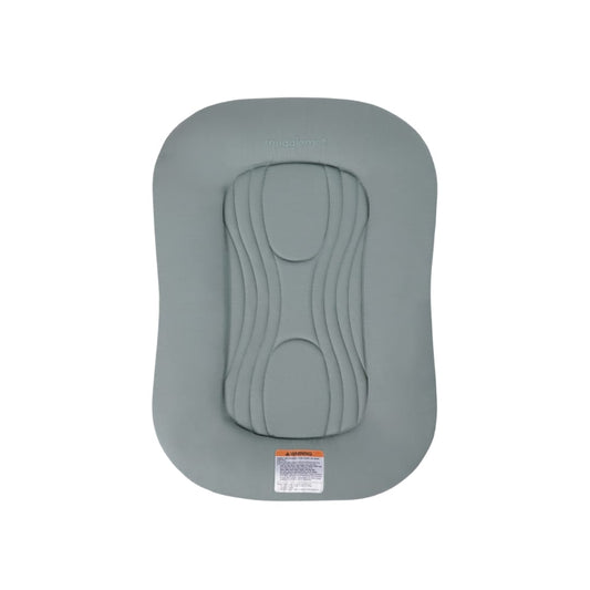 Sage green Snuggle Me infant lounger with central quilted pad and safety warning label