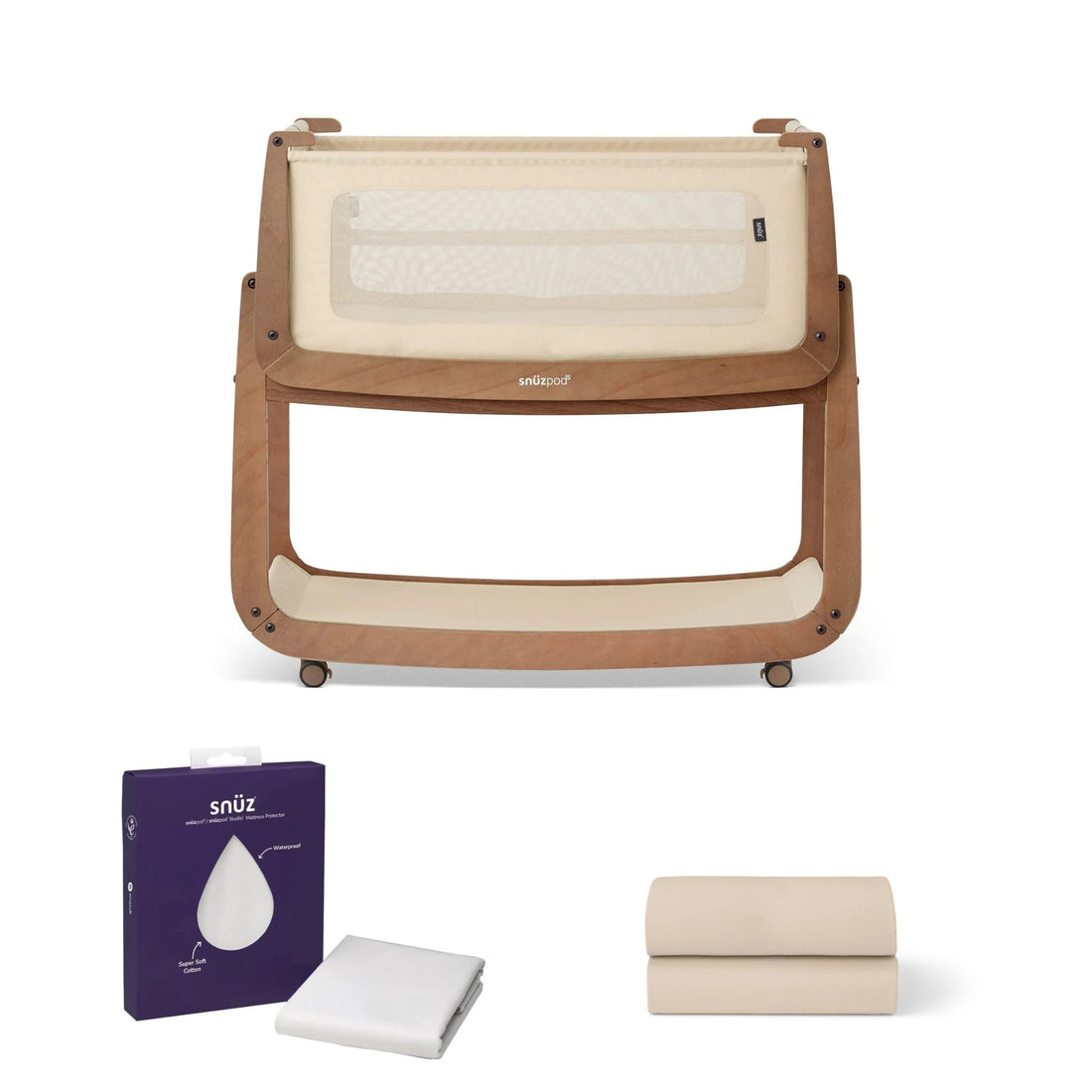 SnuzPod bedside crib with mattress protector and folded sheets