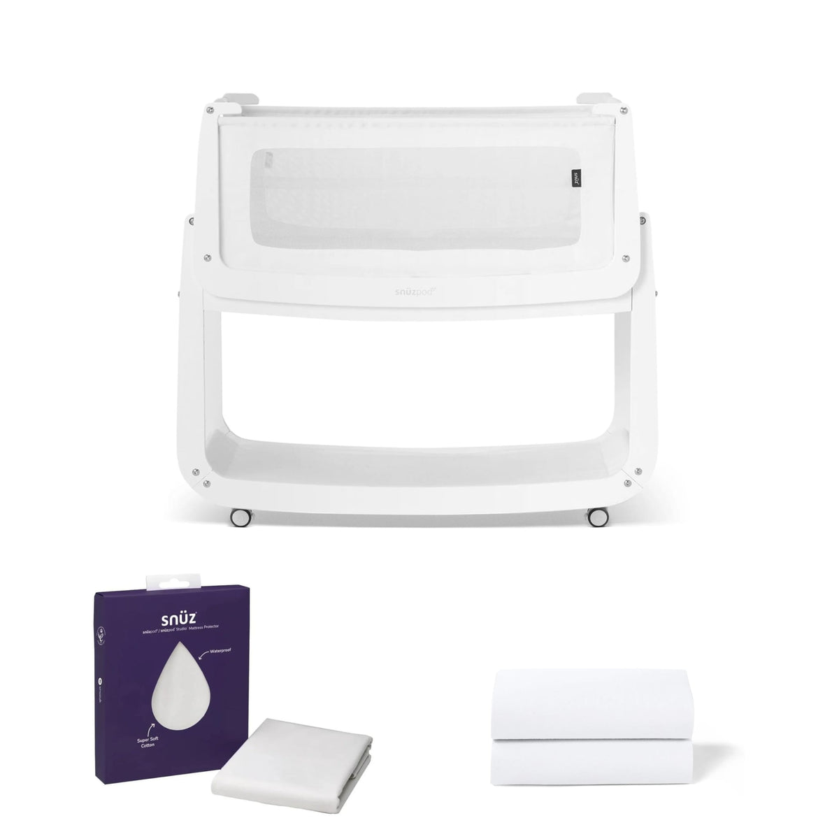 SnuzPod Studio crib with mattress protector packaging and white fitted sheets