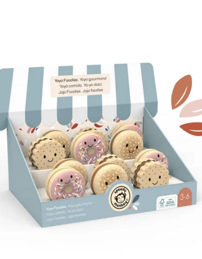 Speedy Monkey wooden toy set featuring assorted sandwich cookies and donuts with faces in a display box