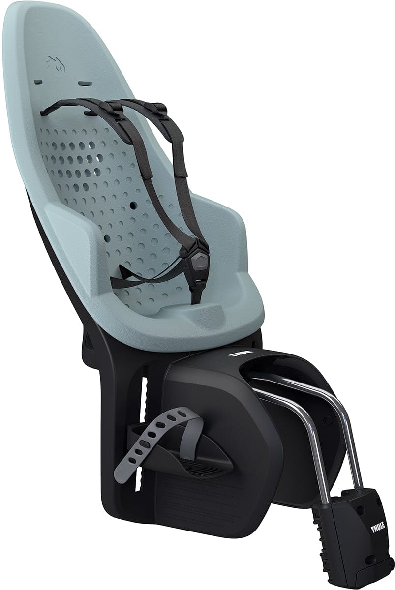 Light blue and black frame-mounted child bike seat by Thule, featuring perforated backrest, adjustable harness, and metal mounting arms, side view.