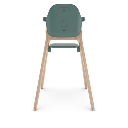 Back view of UPPAbaby high chair with green seat and wooden legs