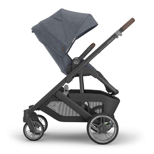 Dusty blue melange full-size stroller by UPPAbaby with carbon frame, chestnut leather accents, and mesh storage basket, side view