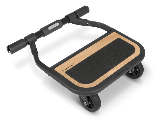 UPPAbaby PiggyBack ride along board with black frame and wood grain standing platform