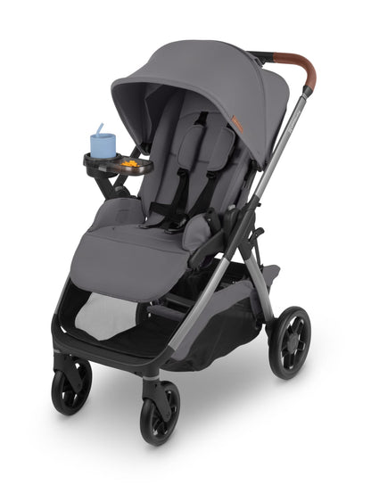 UPPAbaby grey stroller with snack tray and blue cup