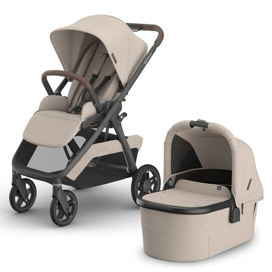 UPPAbaby beige stroller with matching bassinet