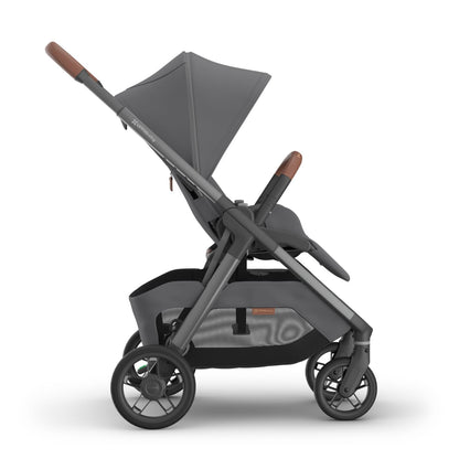 UPPAbaby grey stroller with brown leather handle and bumper bar