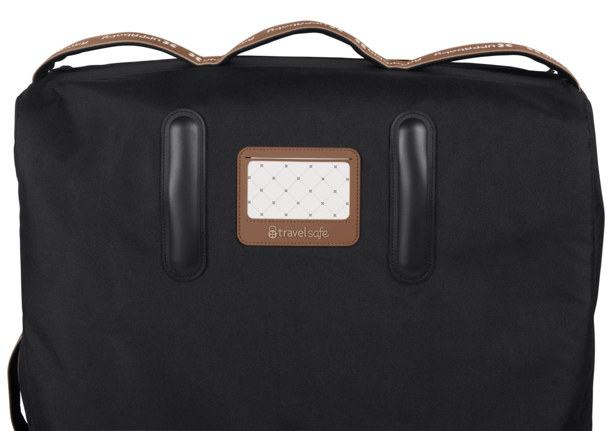 Black UPPAbaby travel bag with brown leather handles and luggage tag