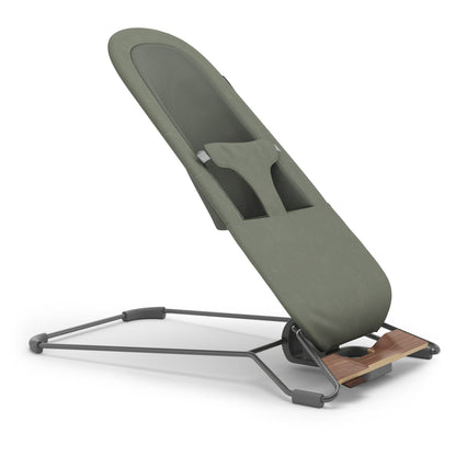 Stokke Steps bouncer in sage green with grey metal frame and wood accents