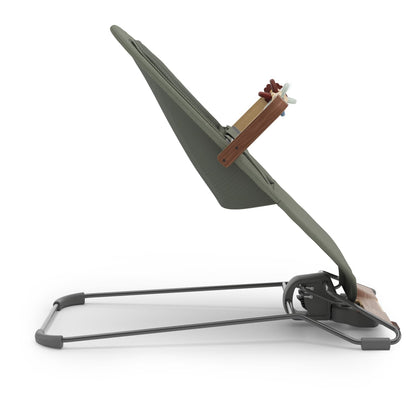 Olive green baby bouncer with wooden toy bar on a white background