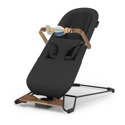 UPPAbaby Mira bouncer in black with wooden accents and toy bar
