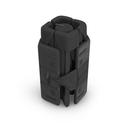 Folded black UPPAbaby travel playard in upright position
