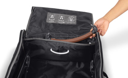 Hand placing UPPAbaby bumper bar into travel bag storage compartment