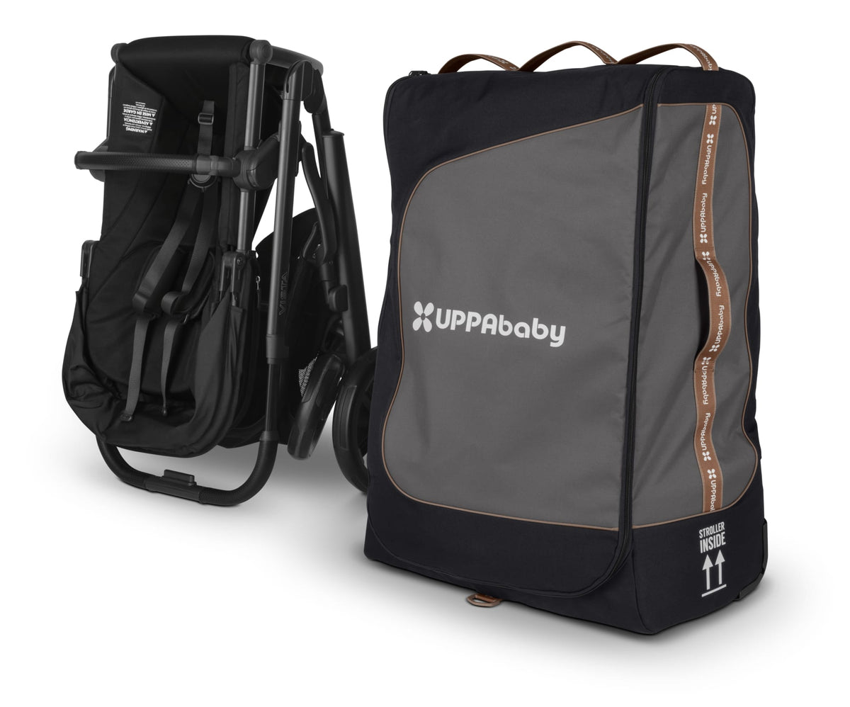 UPPAbaby folded stroller next to a black and grey travel bag