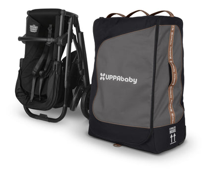 UPPAbaby folded stroller next to a black and grey travel bag