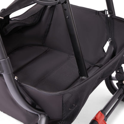 Empty black Valco stroller seat with mesh side panels and metal frame