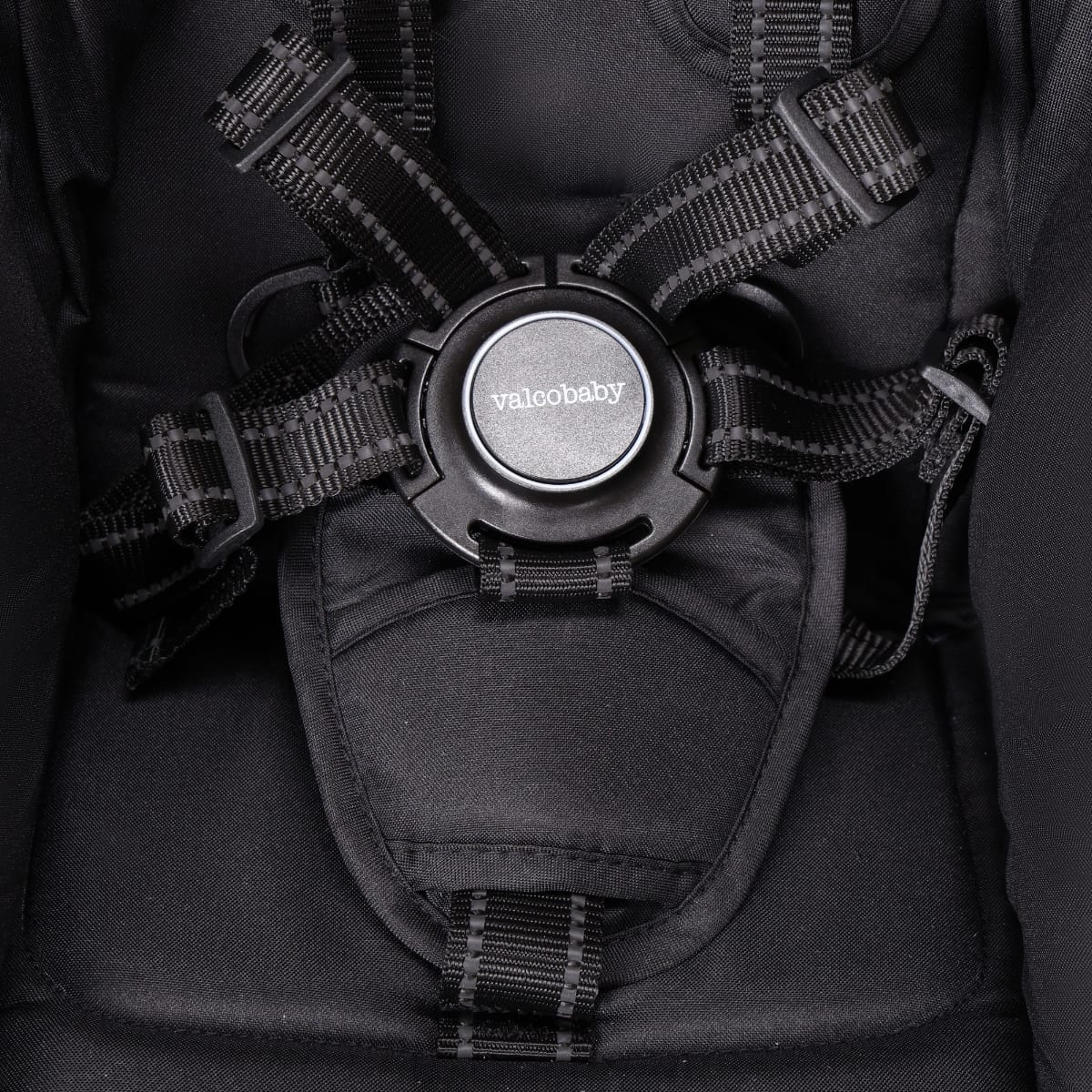 Valco Baby black five point harness buckle on stroller seat