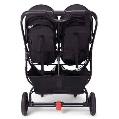 Rear view of black Valco Snap double stroller with storage basket and red brake pedal