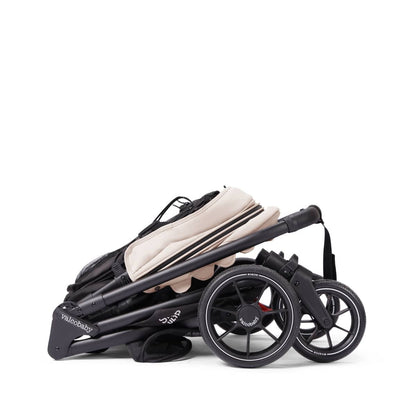 Folded Valco Baby Evalite stroller in beige and black