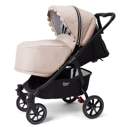 Valco Baby Snap Ultra stroller with beige bassinet and black frame