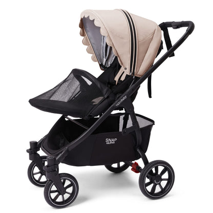 Valco Baby Snap Ultra stroller with beige scalloped canopy and black frame