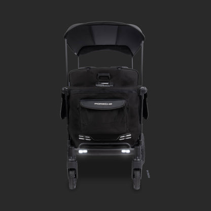 WonderFold Porsche stroller wagon with black canopy and storage pocket