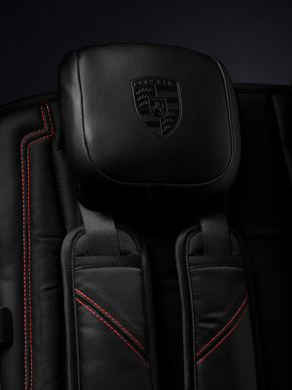 WonderFold black leather headrest with embossed Porsche logo and red stitching