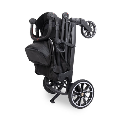 WonderFold stroller folded in black with Porsche branded wheels