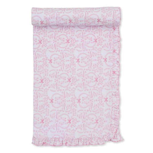 White baby blanket with pink floral and ribbon print and ruffled edge
